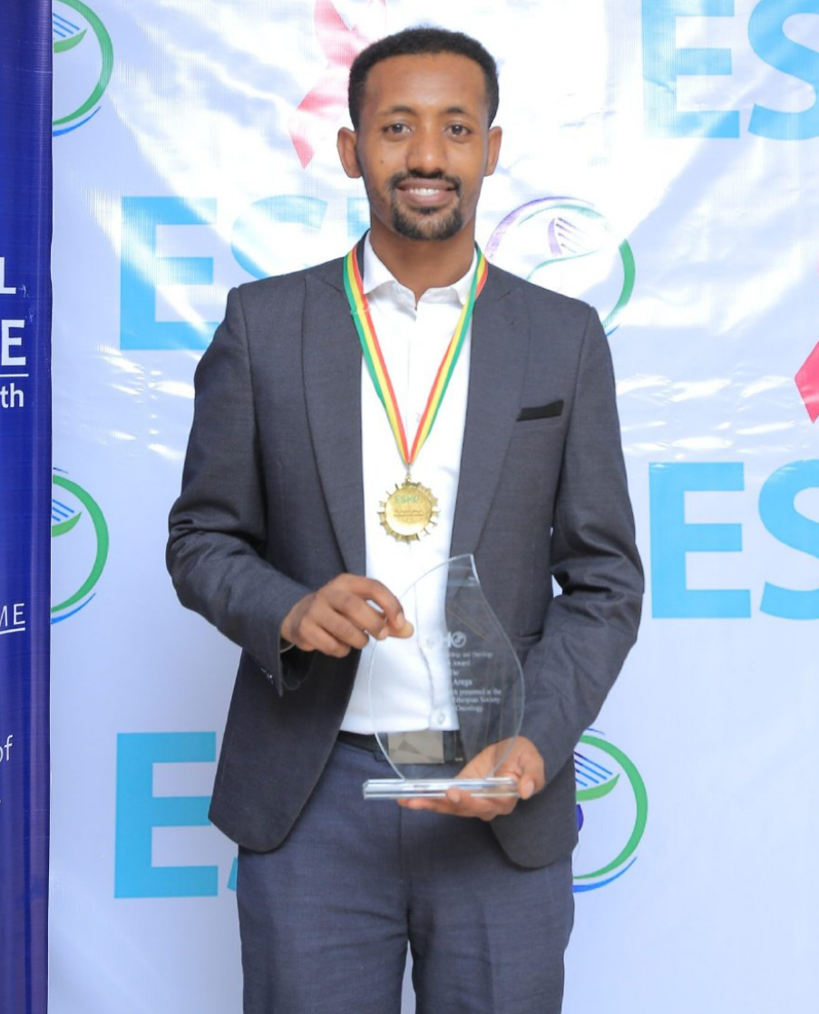 Dr. Gashaw Arega receiving award